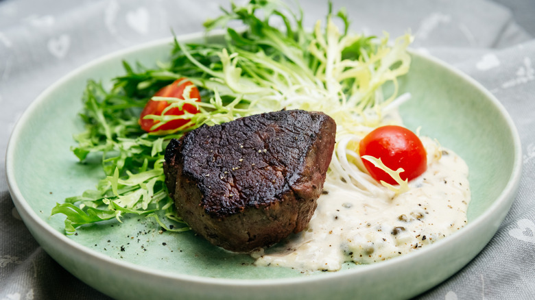 steak with vegetables and sauce