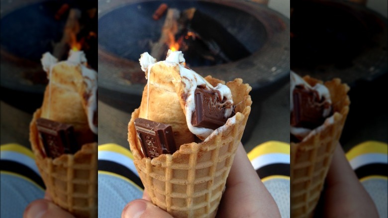 Person hold a s'more cone