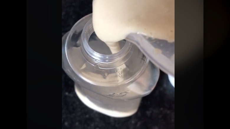 Pouring pancake batter into bottle