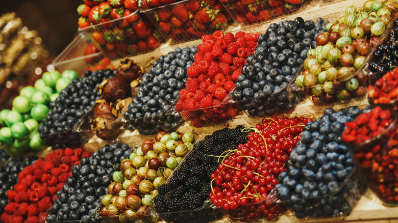 Variety of berries on display at a market