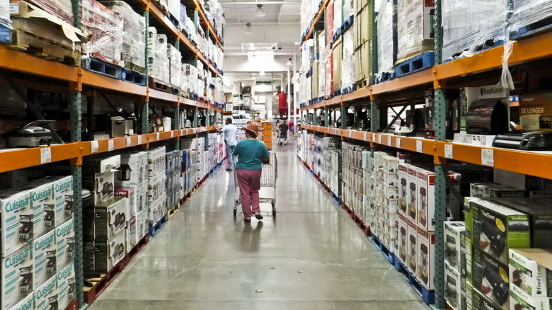 A Costco store aisle with shelves full of products