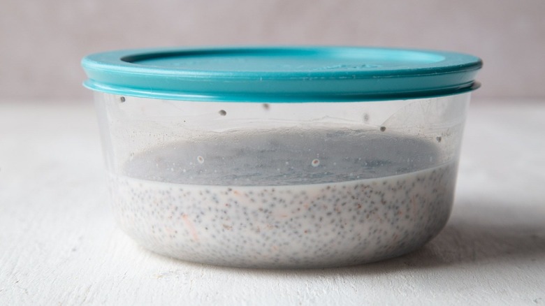 Chia pudding inside bowl with blue lid