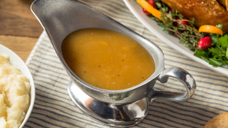 Gravy boat between holiday dishes