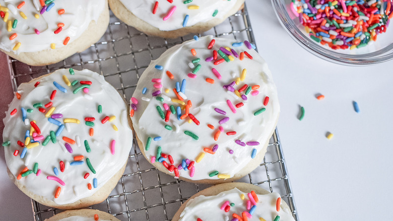 frosted sugar cookies on tray 