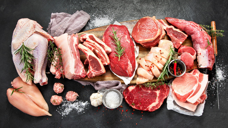 Different types of raw meat including beef, pork, lamb, and chicken.