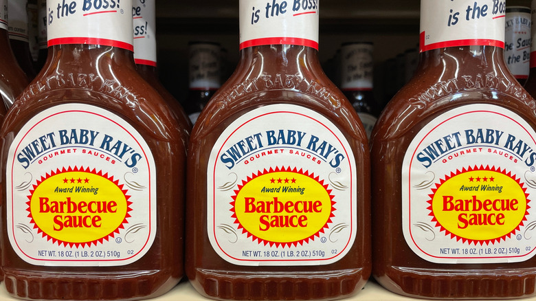 Bottles of Sweet Baby Ray's original barbecue sauce on a shelf