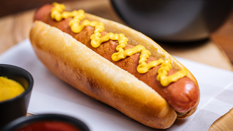 A hot dog with mustard